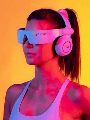 A woman wearing a white sports bra, futuristic visors/smart glasses, and large over-ear headphones, neon pink and yellow lighting.